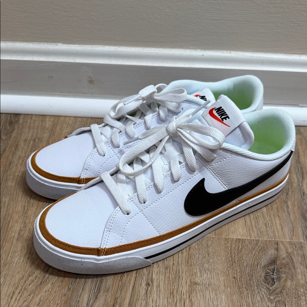 Nike White and Black Athletic Shoes with Gold Accents women’s 11